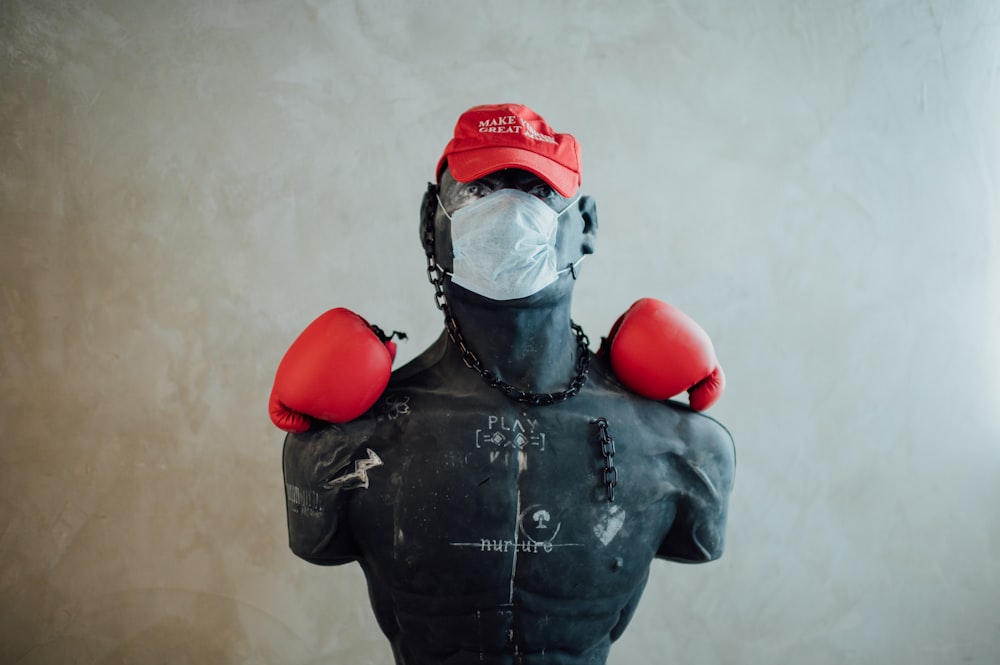 man in black leather jacket wearing red helmet