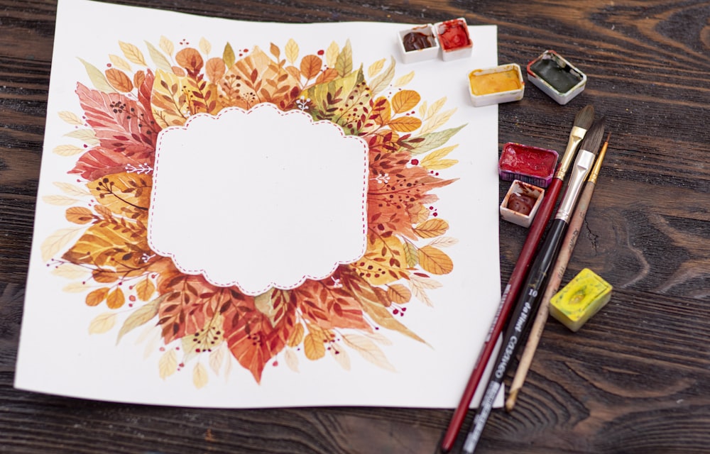 white and red floral ceramic plate