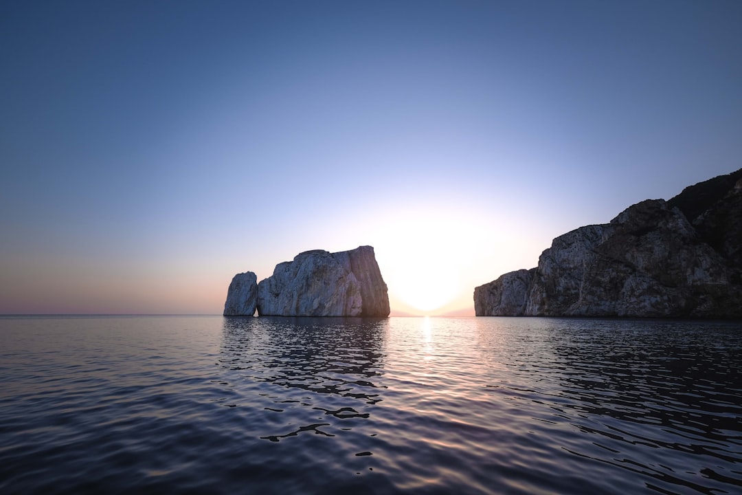 brown rock formation on sea during daytime