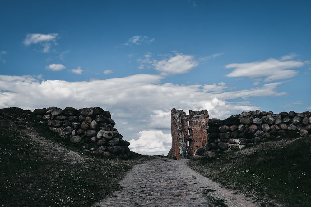 brown and gray stone wall under blue sky during daytime