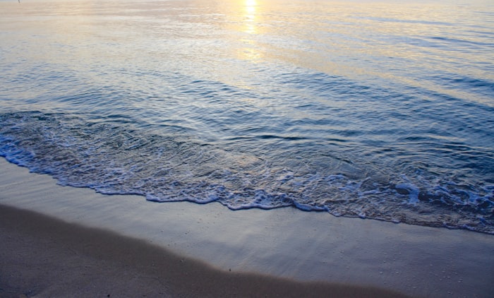 Ocean waves at sunset on Deerfield Beach, northern Broward County Florida