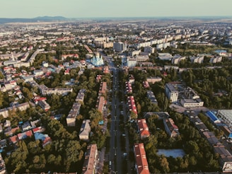 Aerial view of a cityscape with trees and buildings