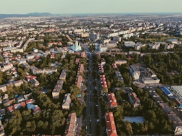 An aerial shot of a vibrant city skyline showcasing various residential properties.