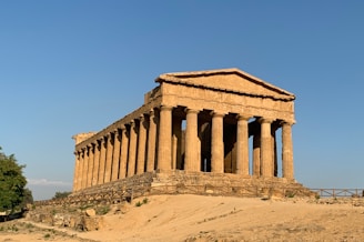 brown concrete building under blue sky during daytime