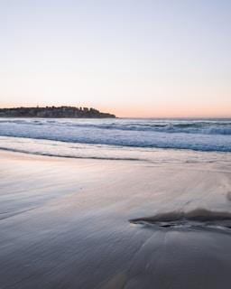 Charming seaside village and calm waves gently lapping Huahin's coast in early morning light