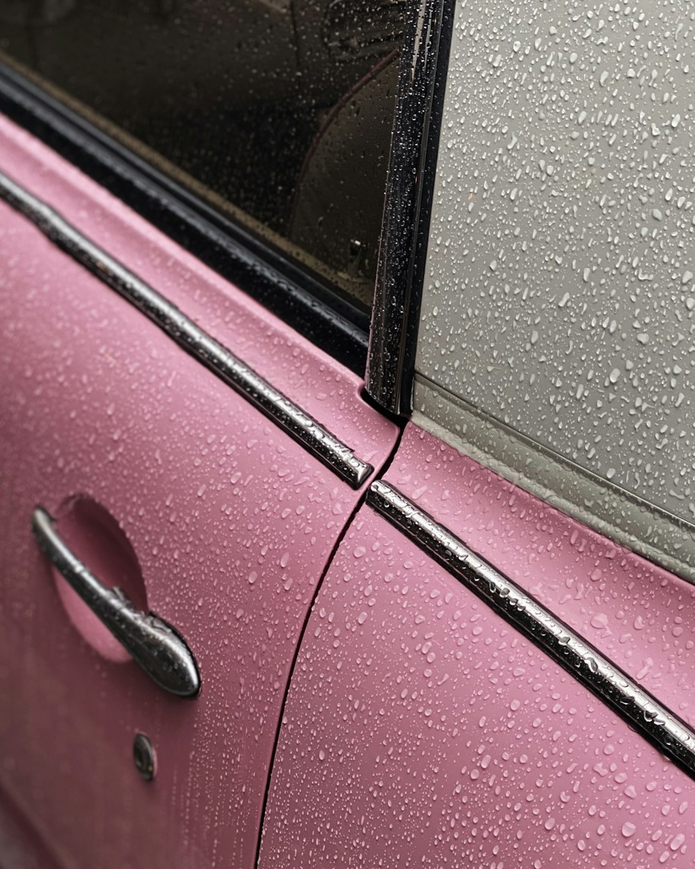 red car door with black door lever