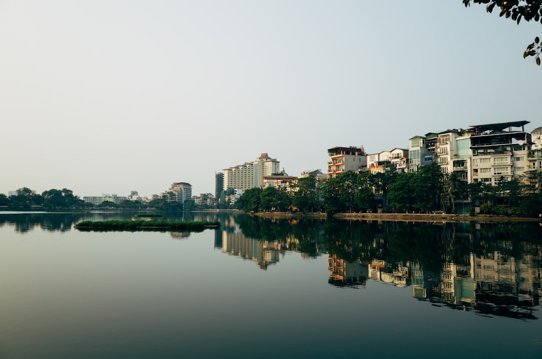 body of water near city buildings during daytime