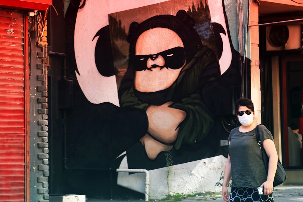 woman in black sunglasses and gray shirt