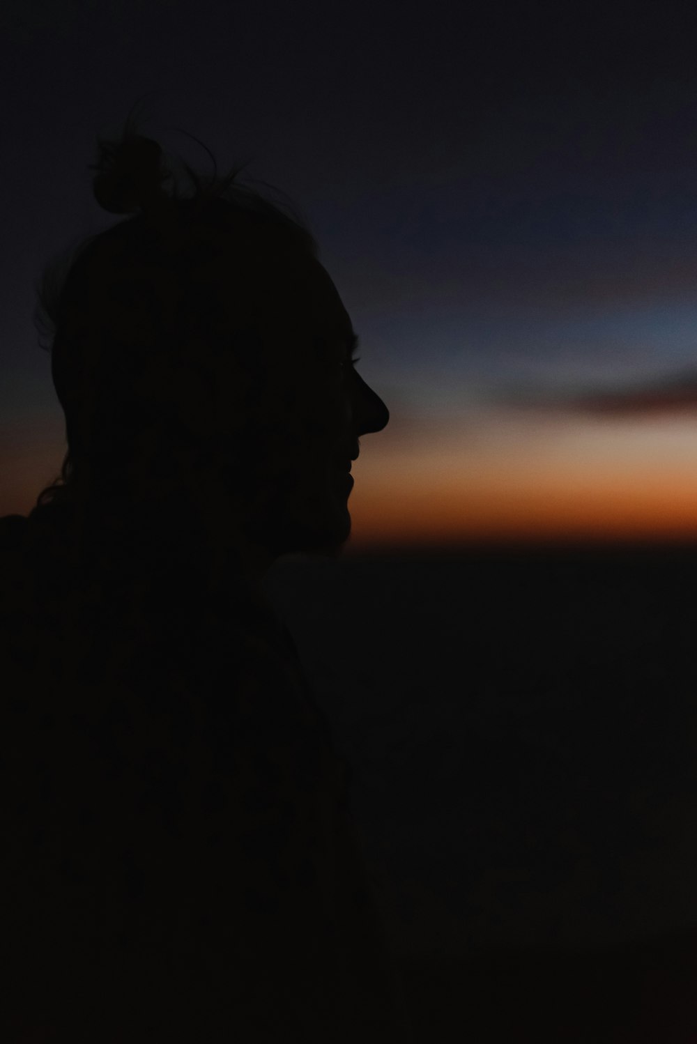 silhouette of person during sunset