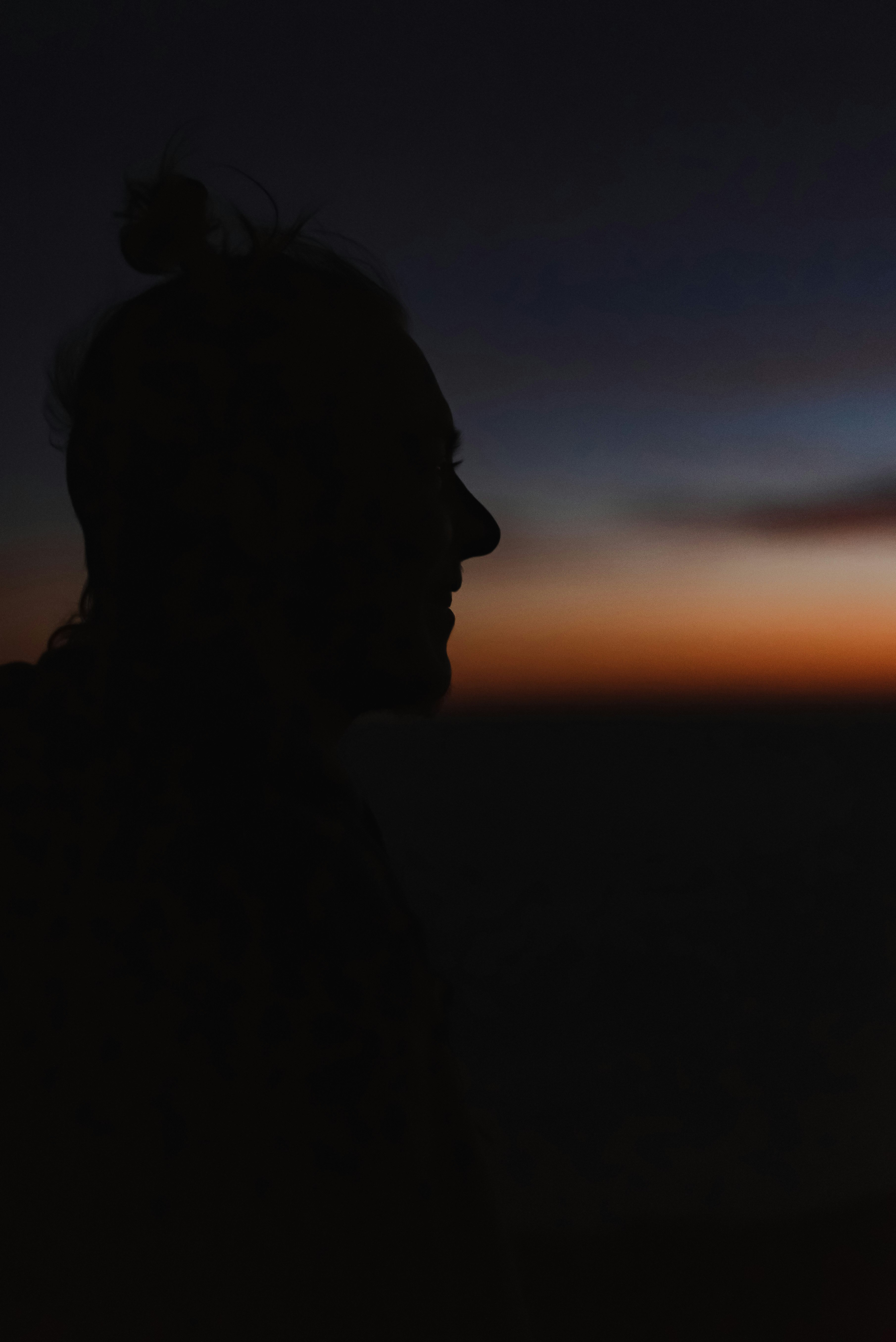 Silhouette of a person during sunset, night fall