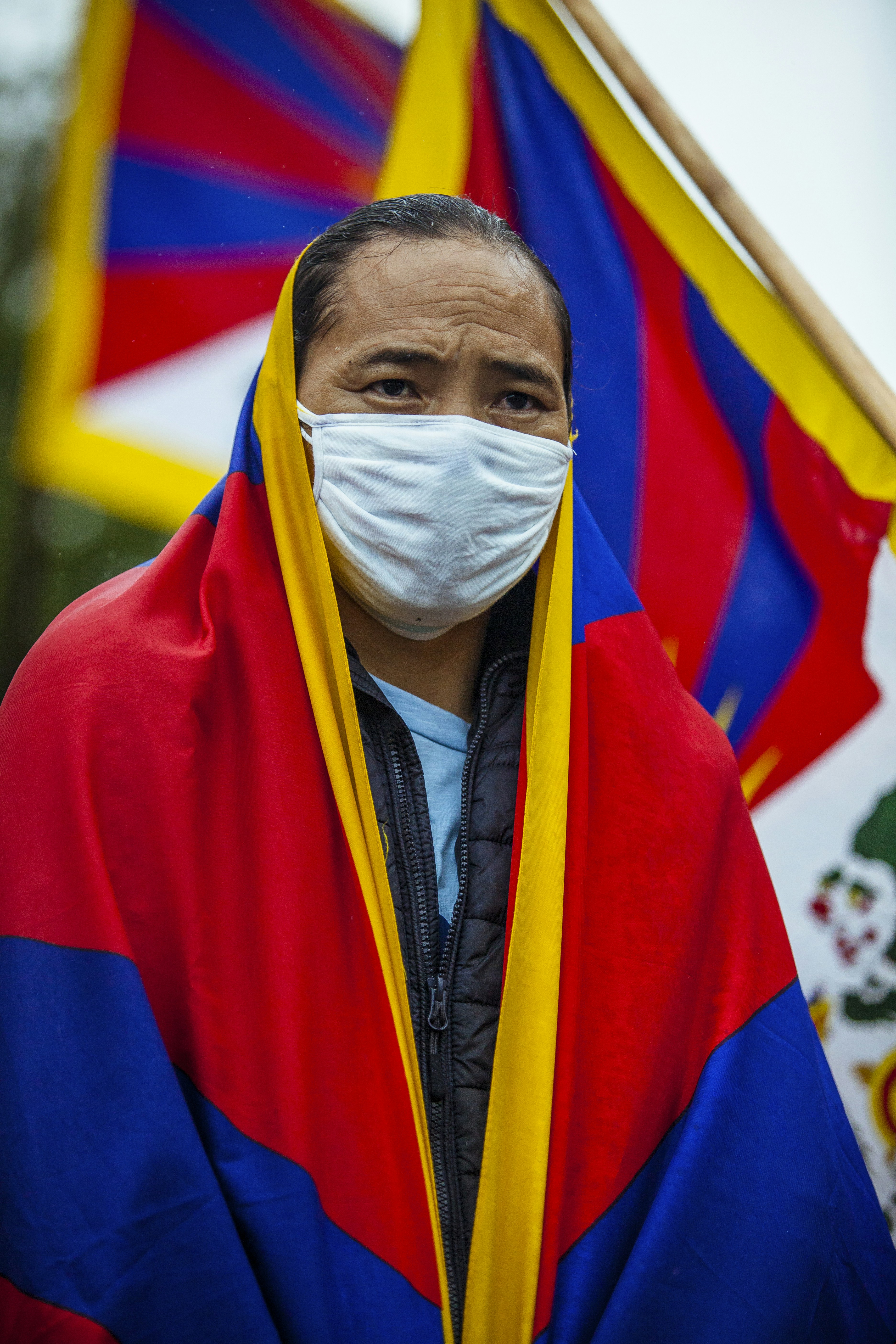 man in red blue and yellow robe