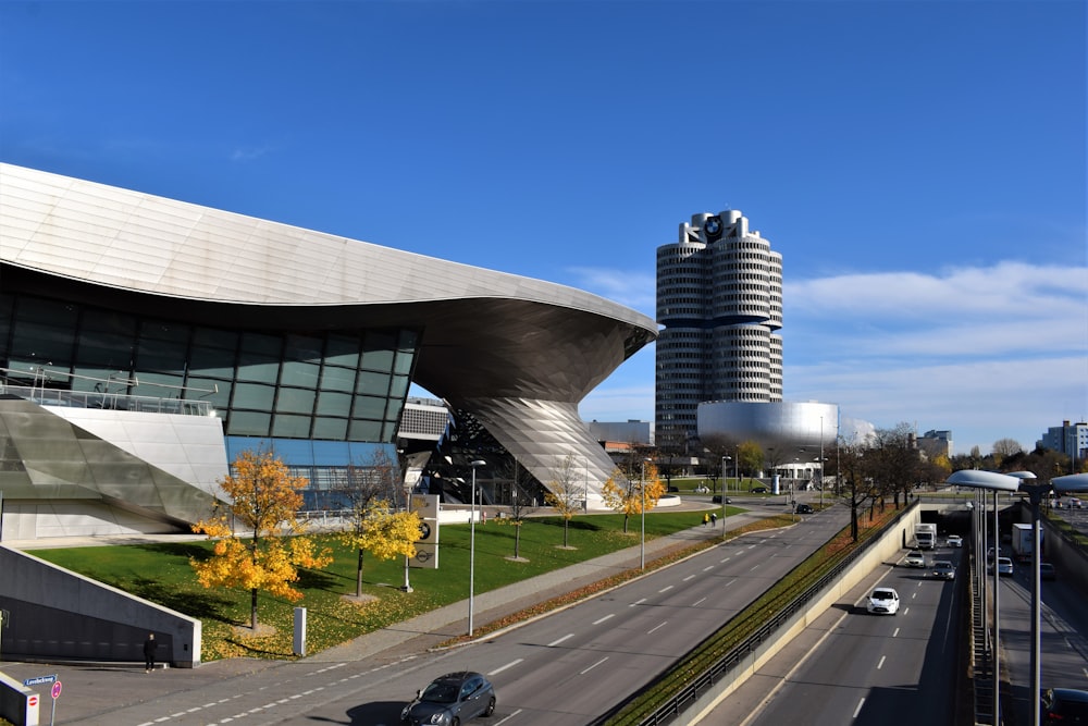 cars parked near gray concrete building during daytime