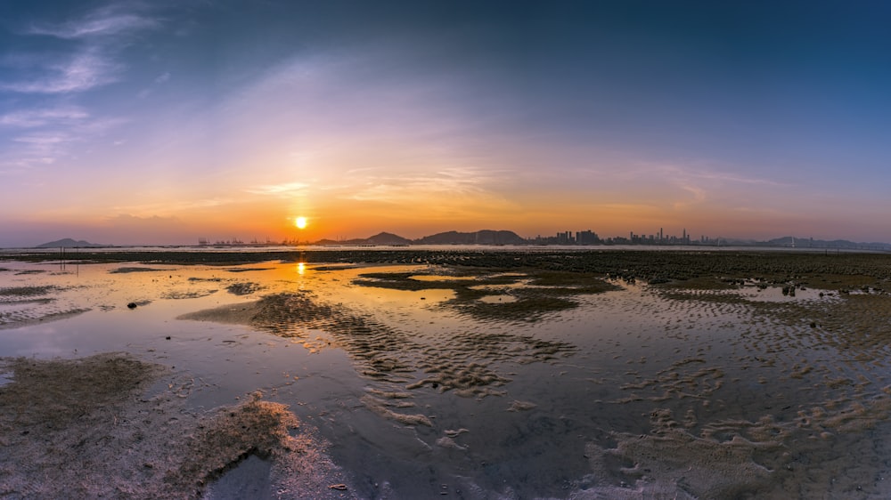 body of water during sunset