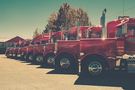 red and black vintage car on road during daytime