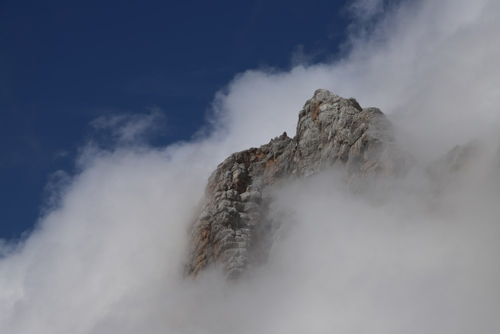 gray rocky mountain under blue sky during daytime