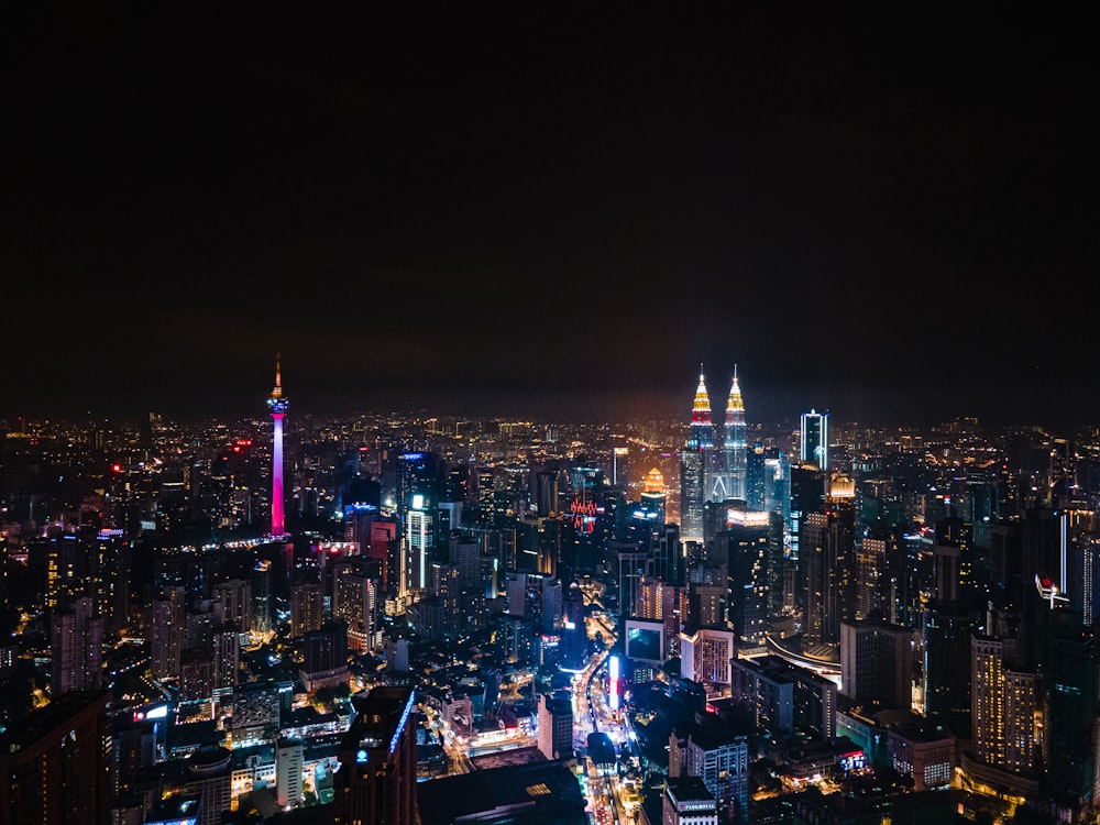 city with high rise buildings during night time