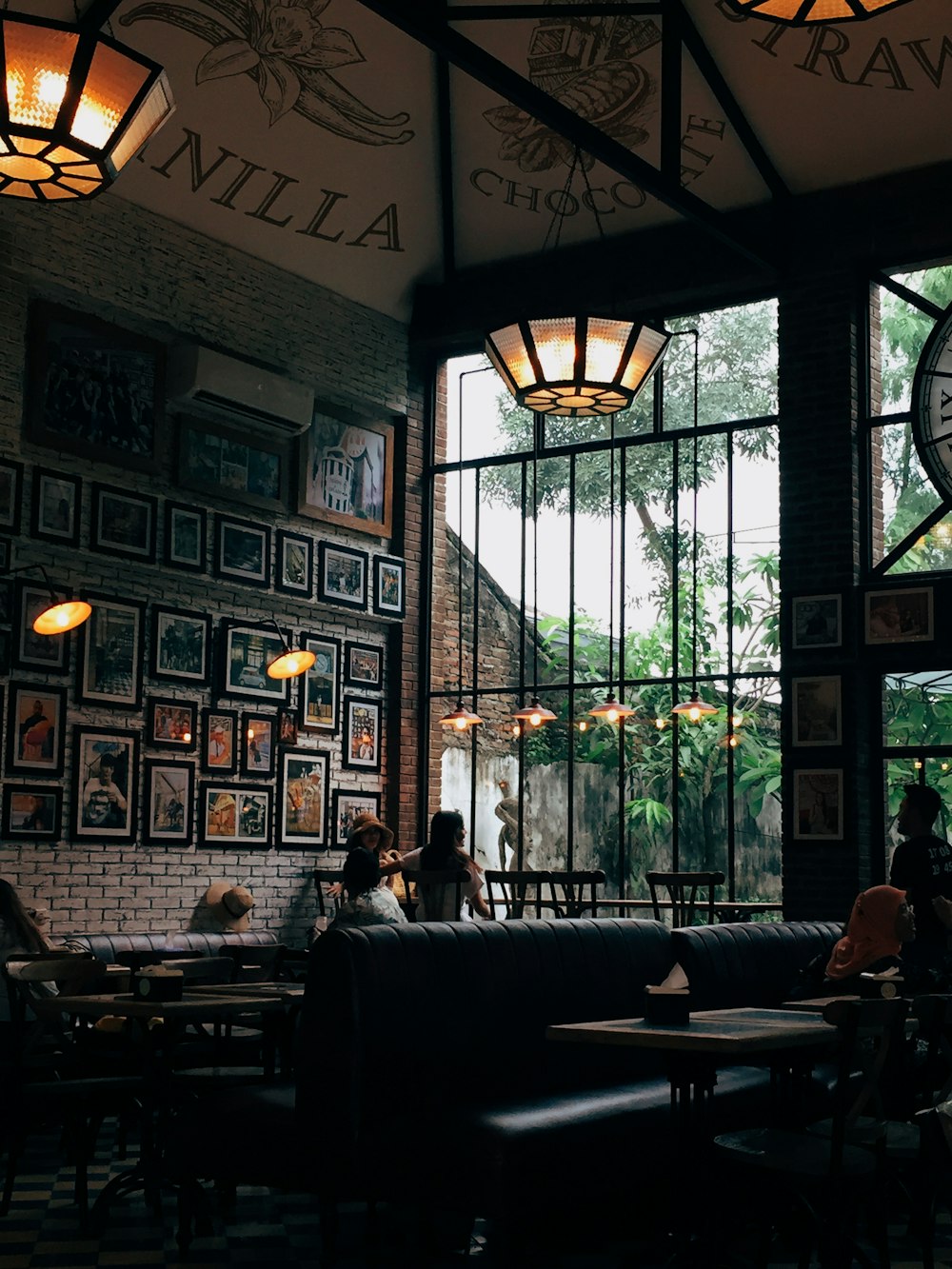 people sitting on chair inside restaurant