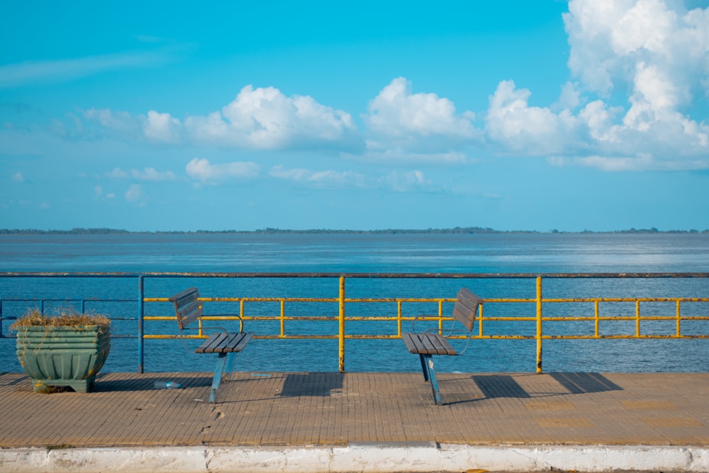 blue and white lounge chairs on beach during daytime