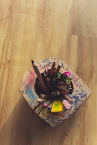 coloring pencils in white and pink floral container