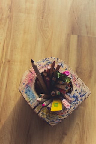 coloring pencils in white and pink floral container