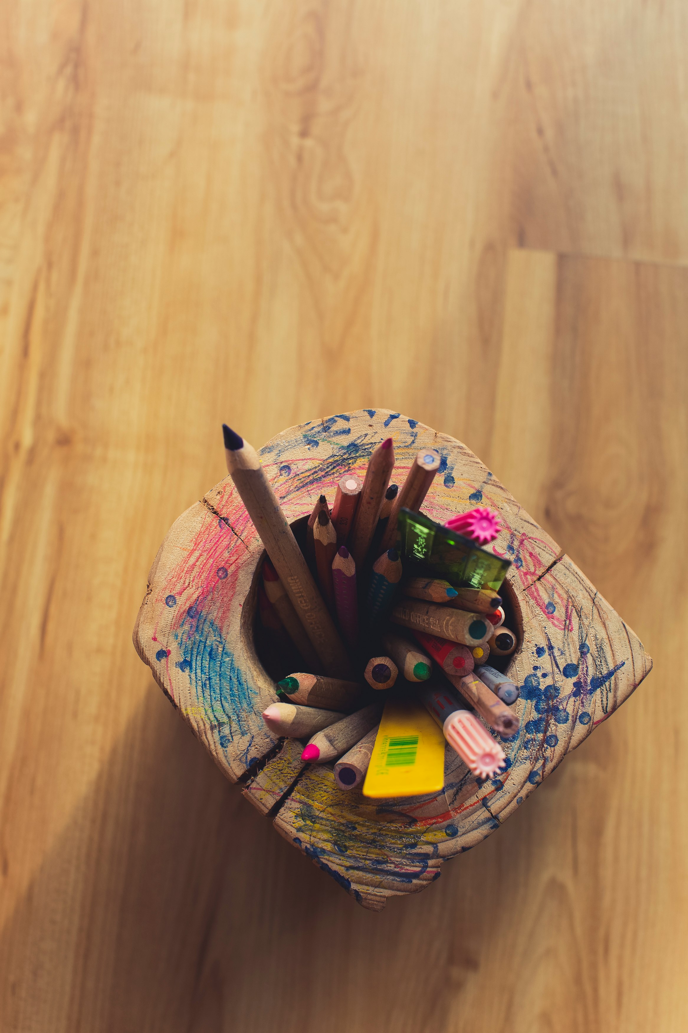 coloring pencils in white and pink floral container