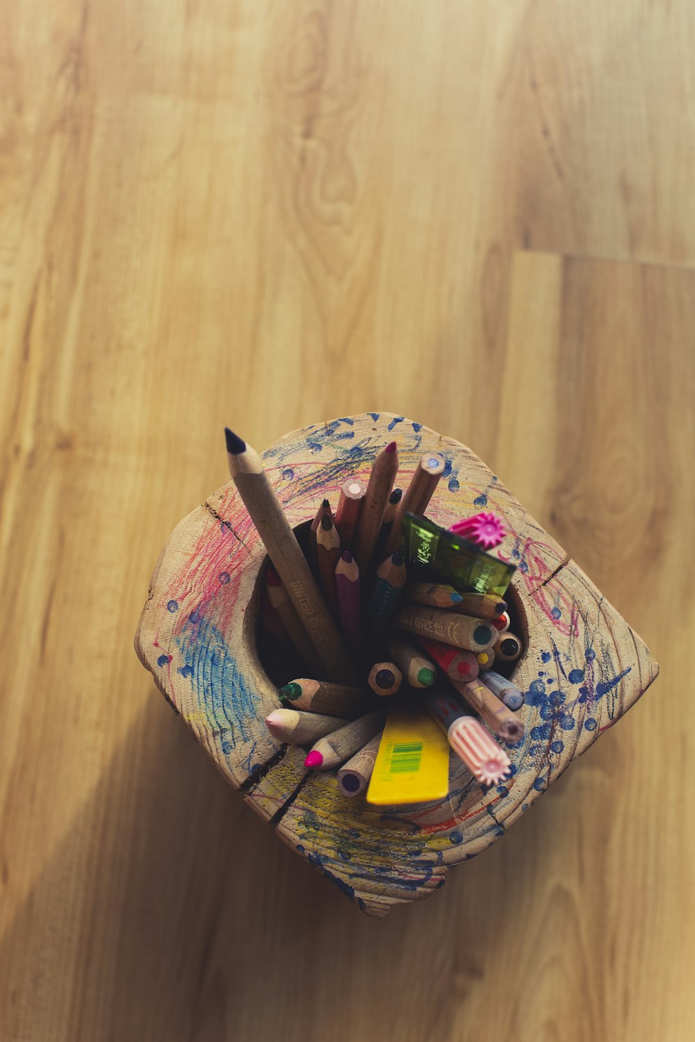coloring pencils in white and pink floral container