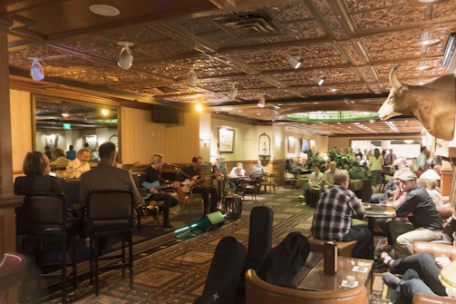 Cozy bistro bar warmly lit with guests enjoying live music
