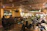 A warmly lit traditional Urfa room filled with guests enjoying live music and dancing.