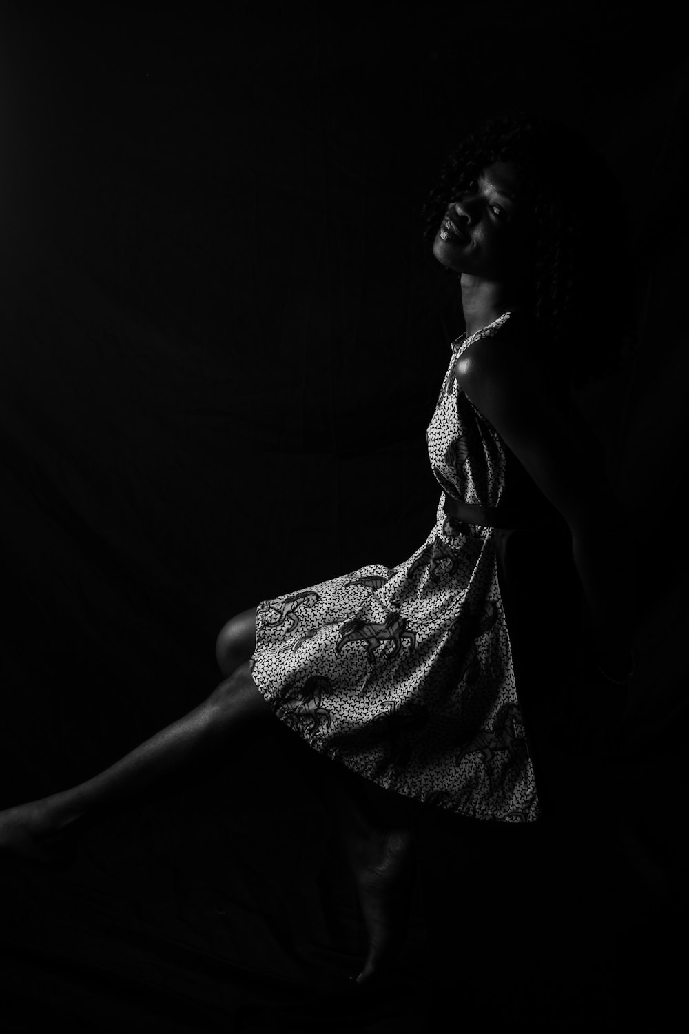 woman in black and white polka dot dress