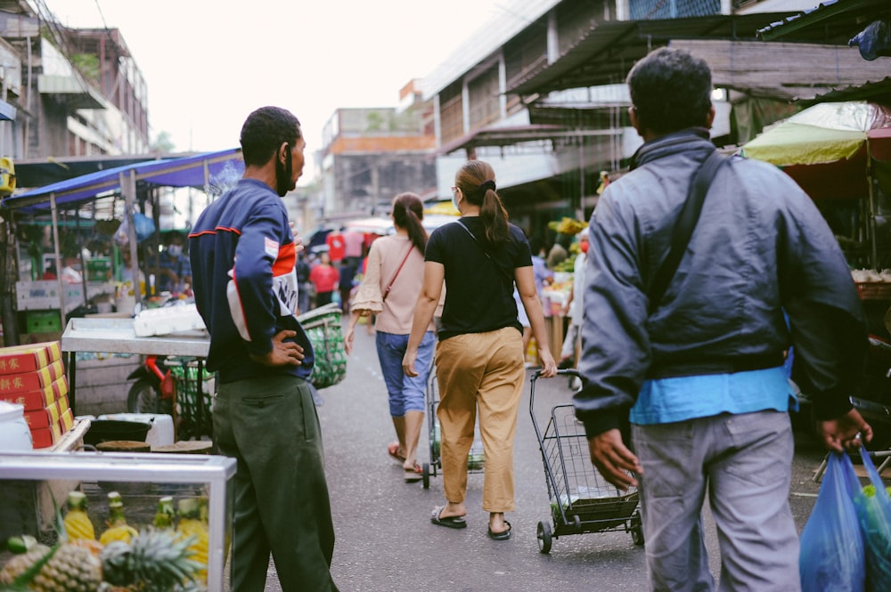 people walking on sidewalk during daytime