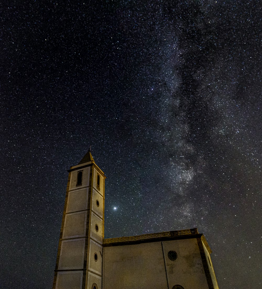 brown concrete building under starry night