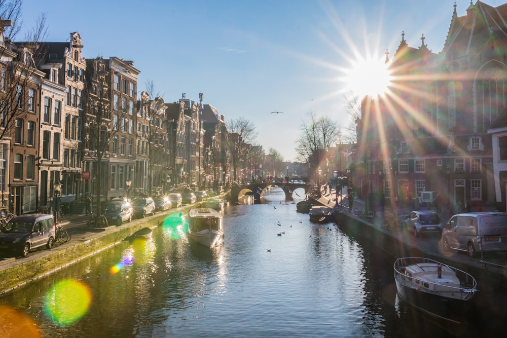 river between buildings during daytime