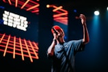 man in blue crew neck t-shirt wearing red cap