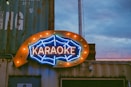 a large neon sign on the side of a building