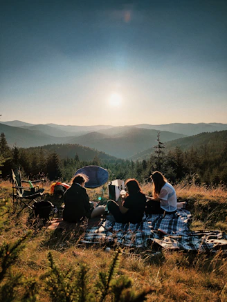 friends having a picnic with a mountain view 