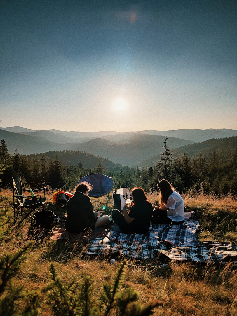 friends having a picnic with a mountain view 