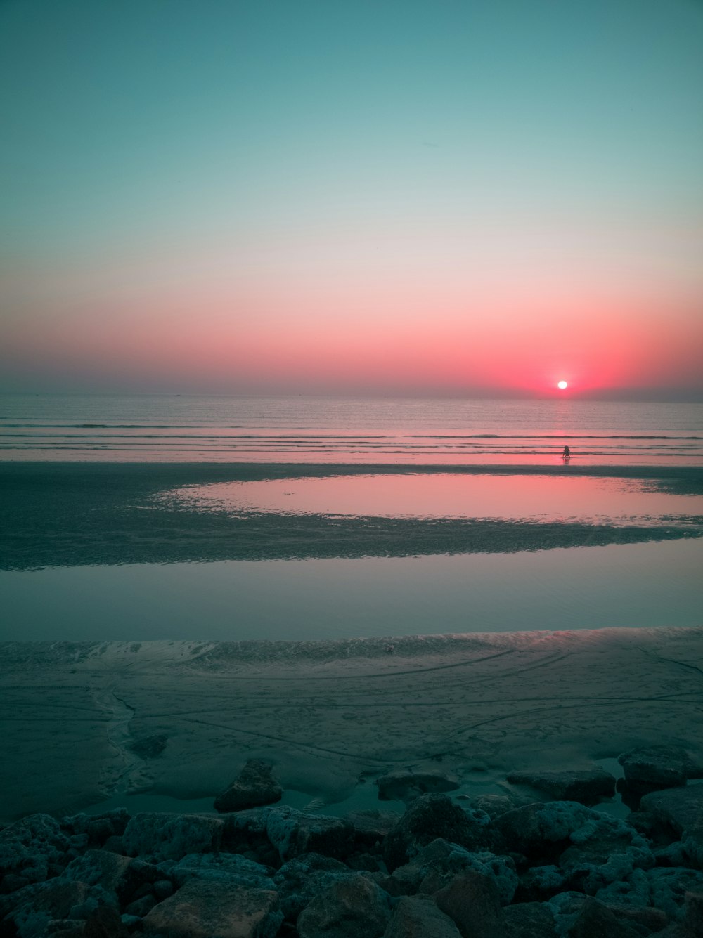 body of water during sunset