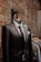 black suit jacket near brown brick wall