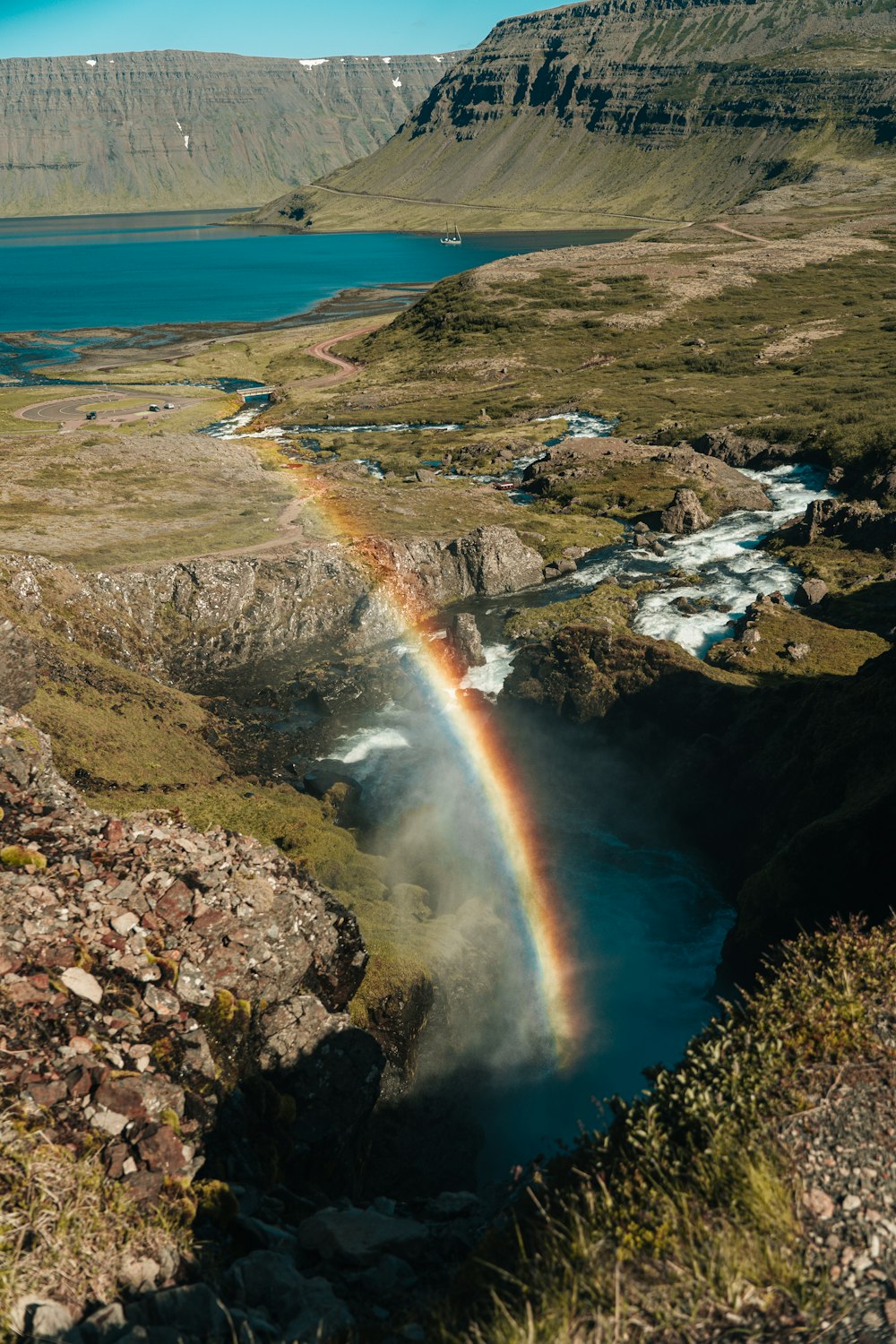 rainbow over the mountain during daytime