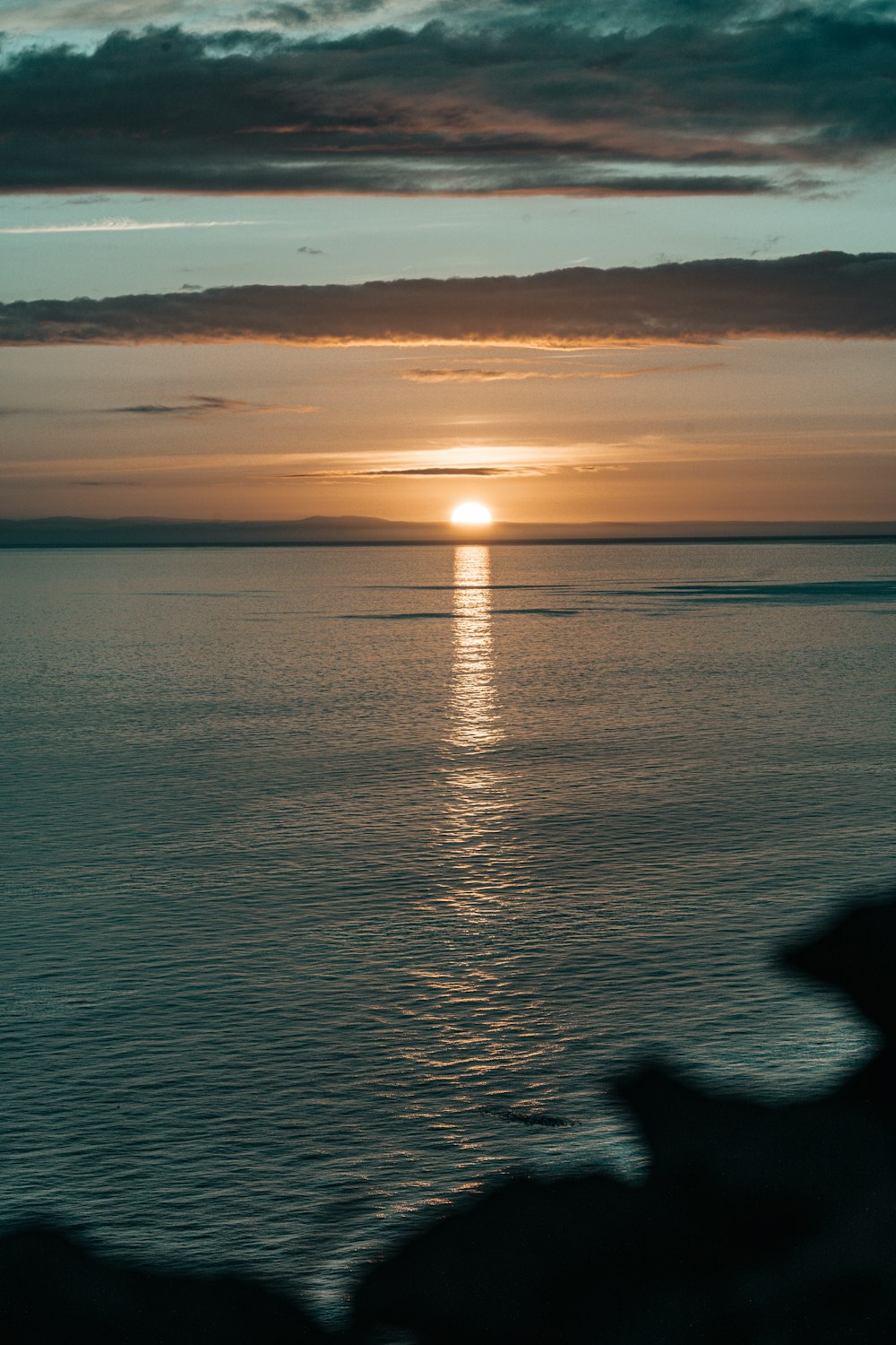 body of water during sunset