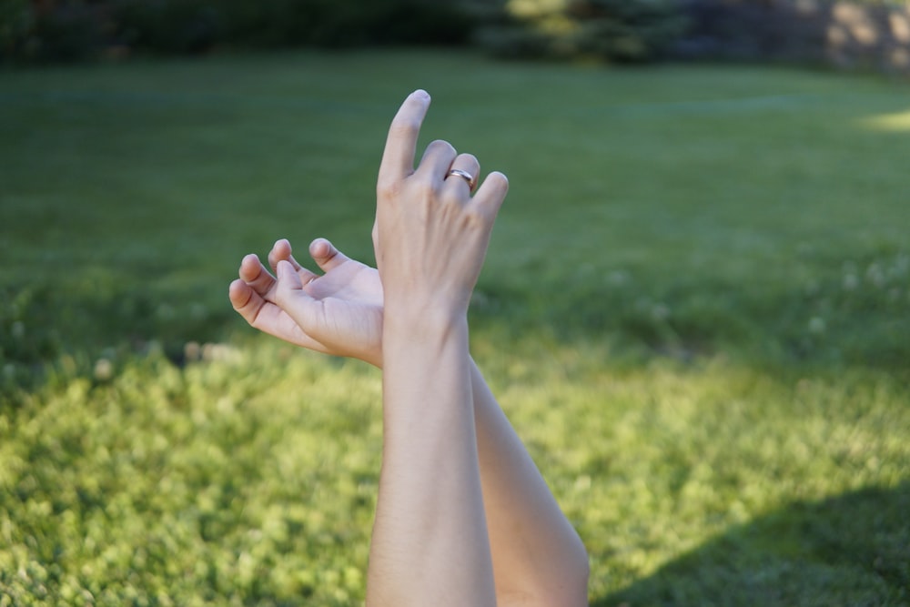 persons feet on yellow flower field during daytime