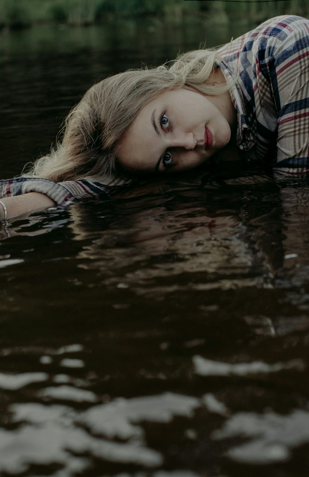 woman in black and white plaid shirt