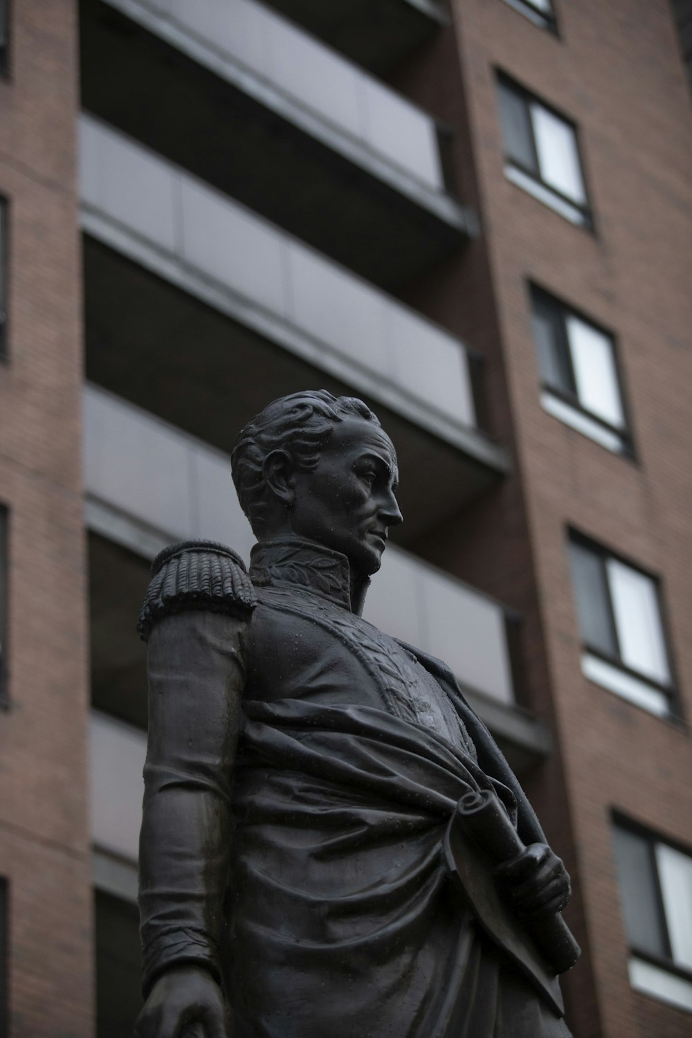 black statue of man in black leather jacket