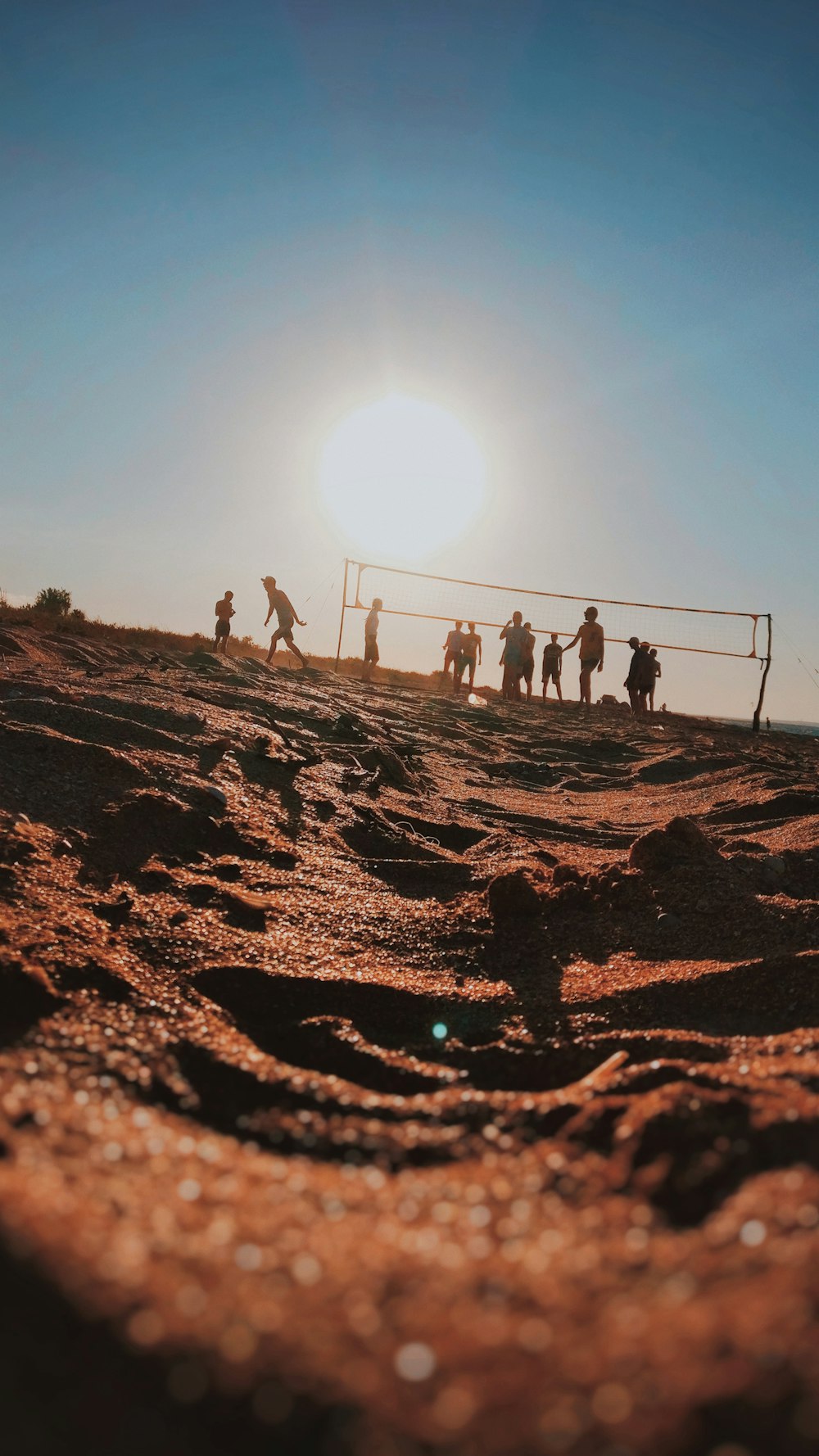 people walking on brown sand during daytime