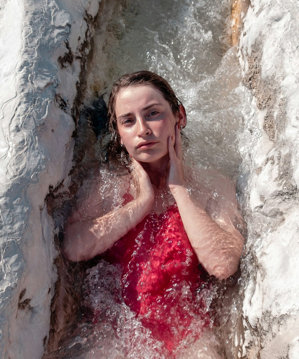 woman in red tube dress in water