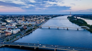aerial view of city buildings near body of water during daytime