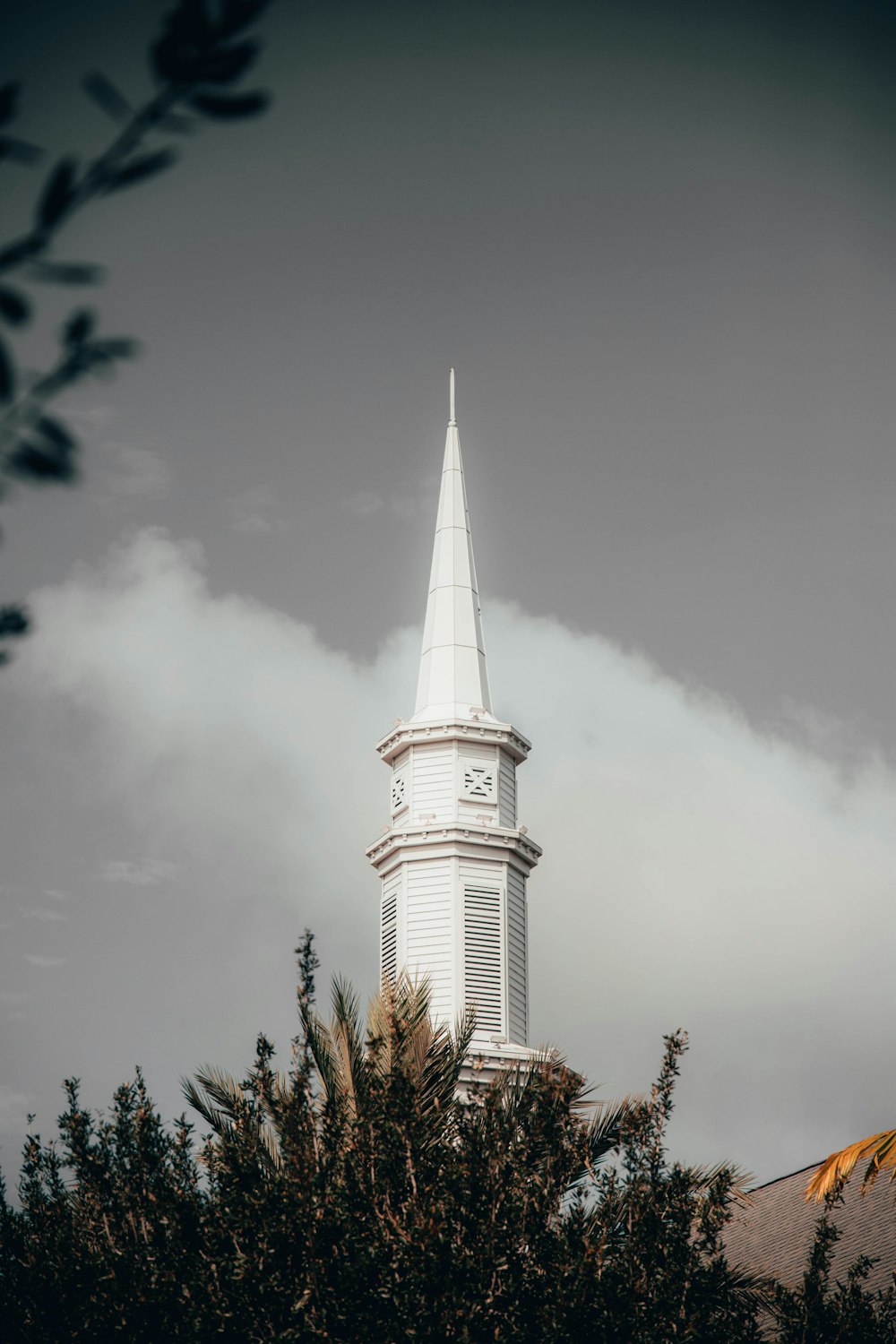 white and brown concrete tower under cloudy sky