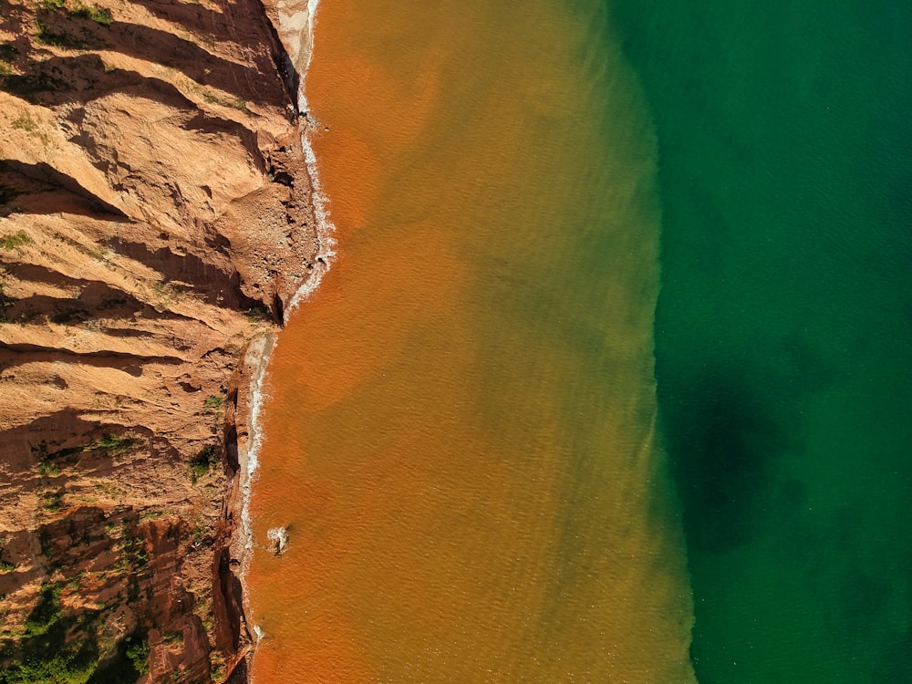 aerial view of brown and green sea