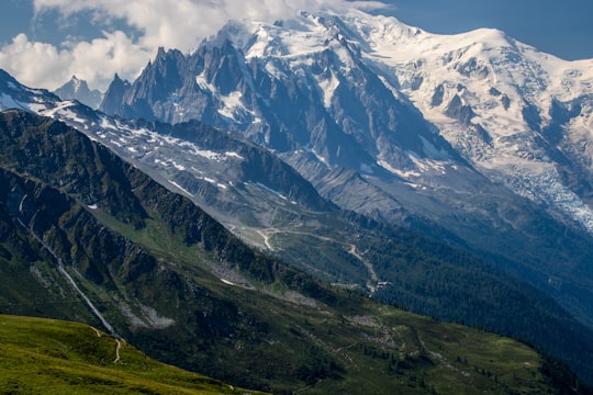 green and white mountains under white clouds during daytime in Mont Blanc France