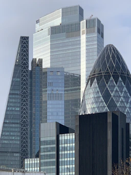 white and blue glass walled high rise building